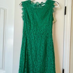 New, never worn green lace dress with bow details in the back.